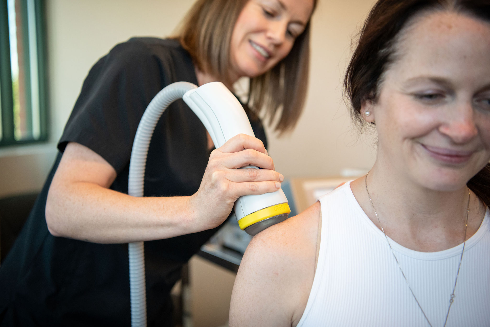 New Heights provider administering SoftWave shoulder treatment